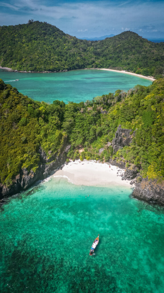 Nui Beach, Ko Phi Phi with a longtail boat