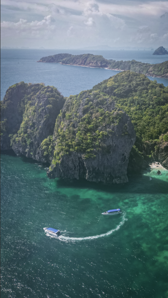 Rocks next to Nui Beach with boat